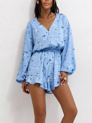 Blue floral V-neck cinched waist romper with button front and ruffled hem.