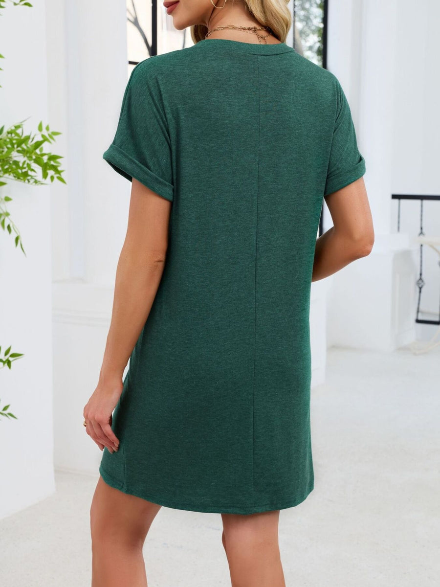 Dark green t-shirt dress with cuffed short sleeves and above-knee length.