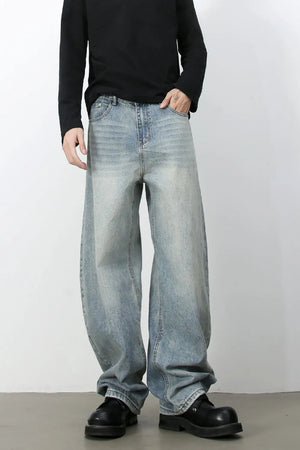 Faded baggy denim jeans in light blue with a relaxed fit.
