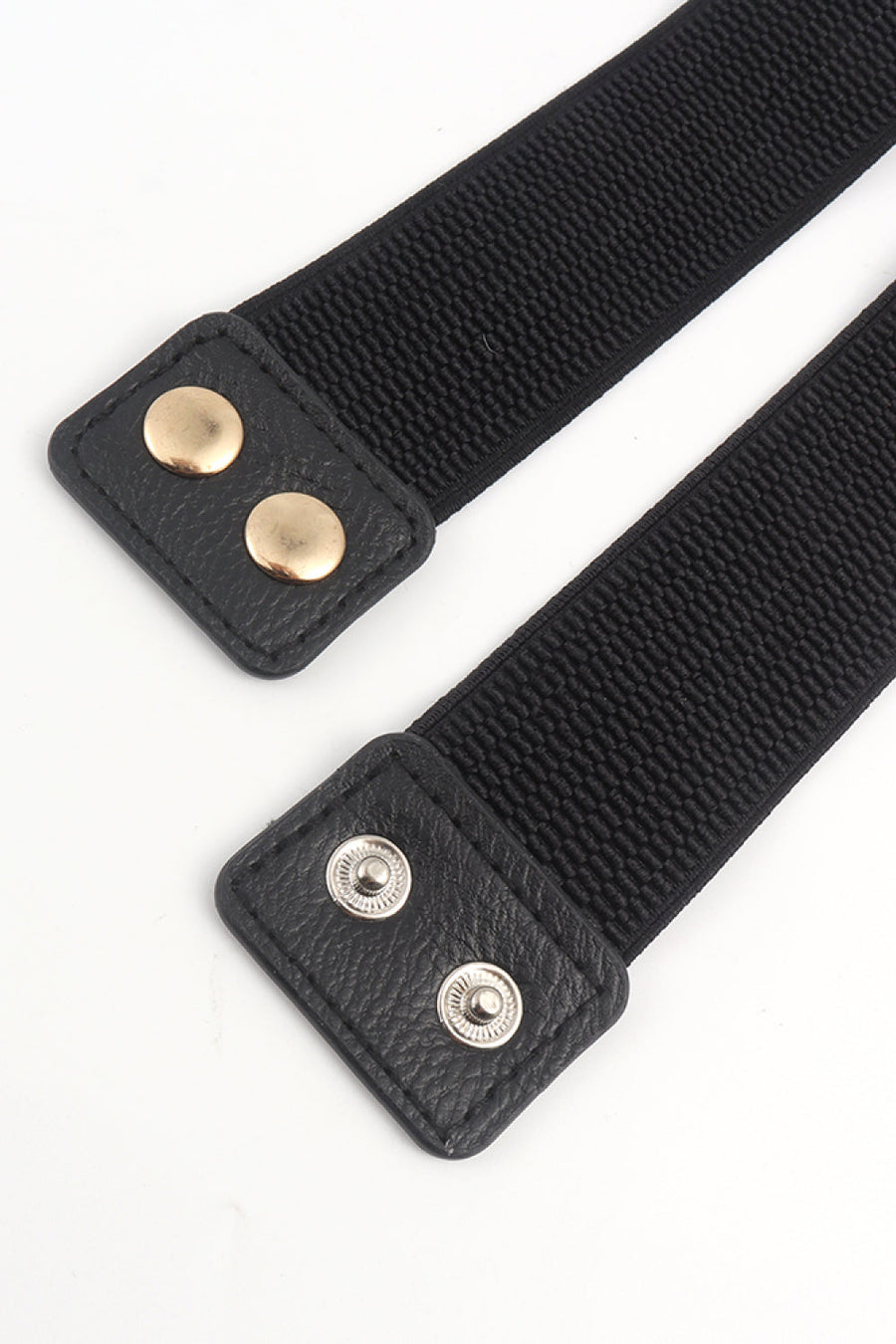Black elastic belt with faux leather ends and gold and silver snap details