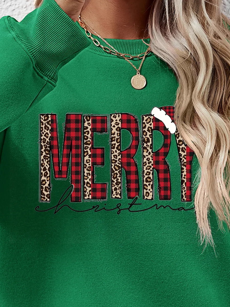Green graphic sweatshirt with "Merry Christmas" in buffalo plaid and leopard print.