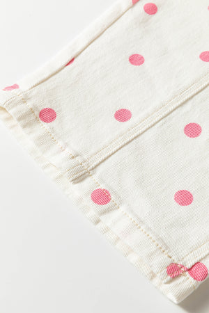 light pink wide-leg jeans with button-front and polka dot