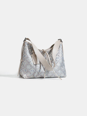 handbag in light blue with geometric and adjustable strap