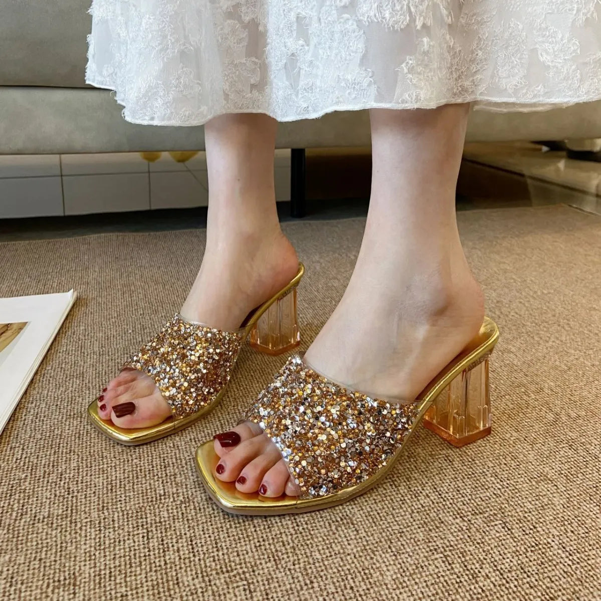 Gold glitter embellished lucite heel mules with clear block heel.