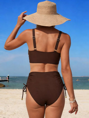 Brown high-waisted bikini with ruched sides and drawstring ties.