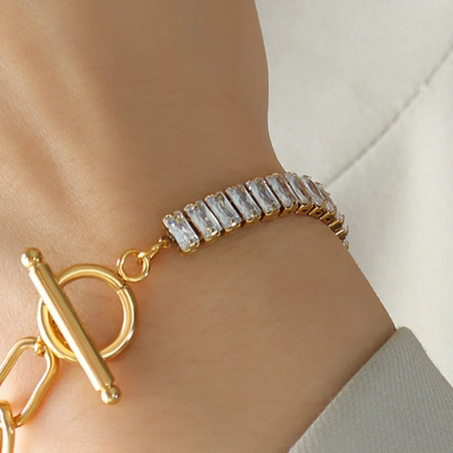 Gold chain-link bracelet with baguette cubic zirconia and toggle clasp