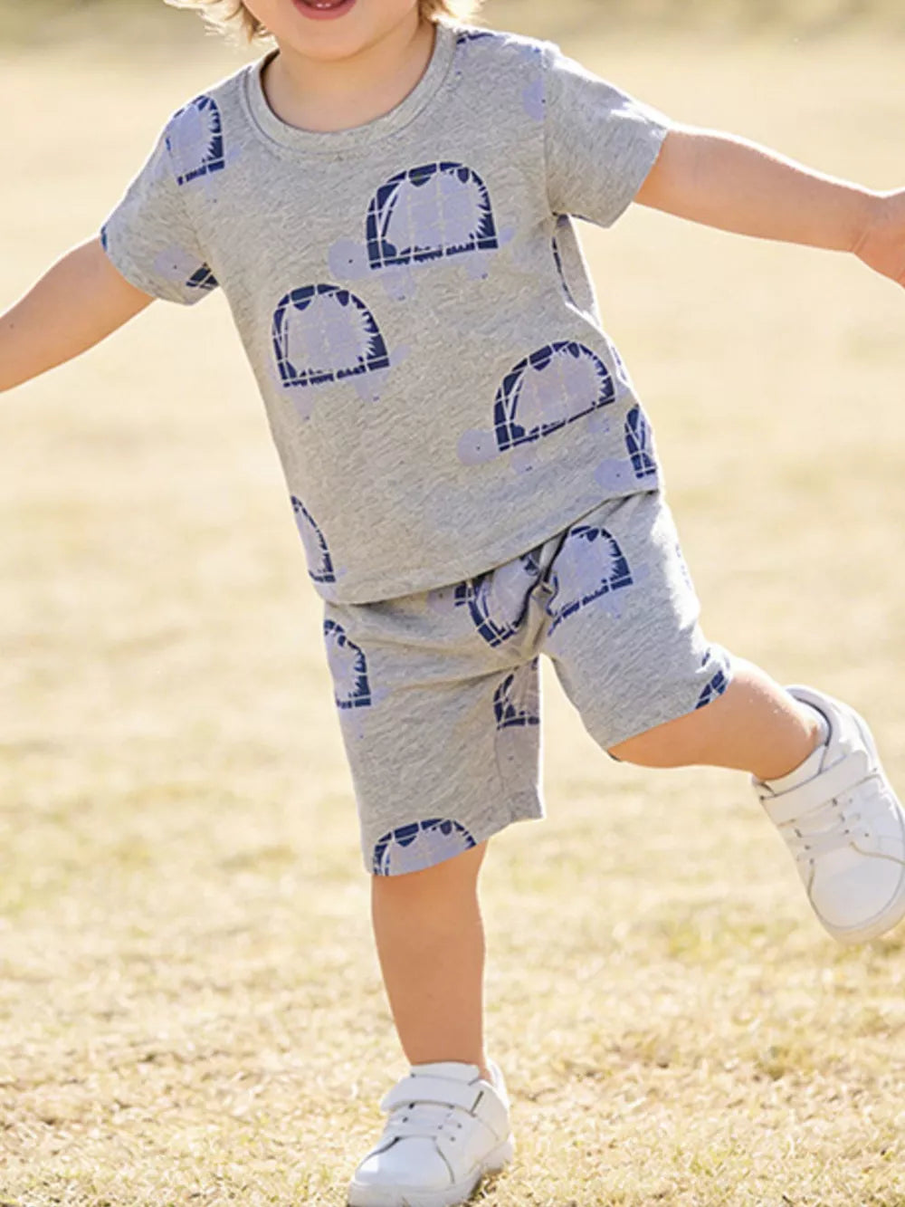 Grey cotton toddler boys' set with blue turtle print, short sleeves, and shorts.