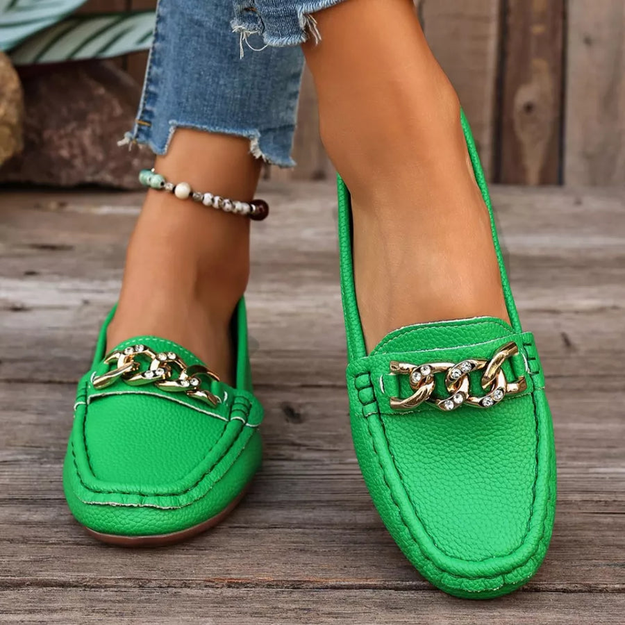 Green round-toe loafers with gold chain and crystal detail