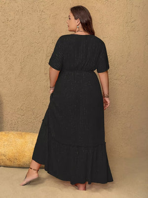 Plus size black V-neck maxi dress with metallic threads and tiered ruffle hem.