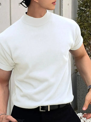 White mock neck knit tee with rolled short sleeves.