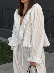 White blouse featuring frill and striped
