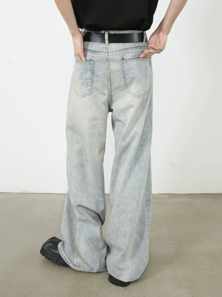 Light faded denim palazzo jeans with relaxed, oversized fit and wide leg