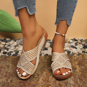 Off-white rhinestone-embellished criss-cross open toe wedge sandals with comfortable platform sole.