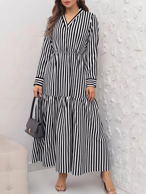 Notched long-sleeve midi dress in black and white stripes with a tiered skirt.