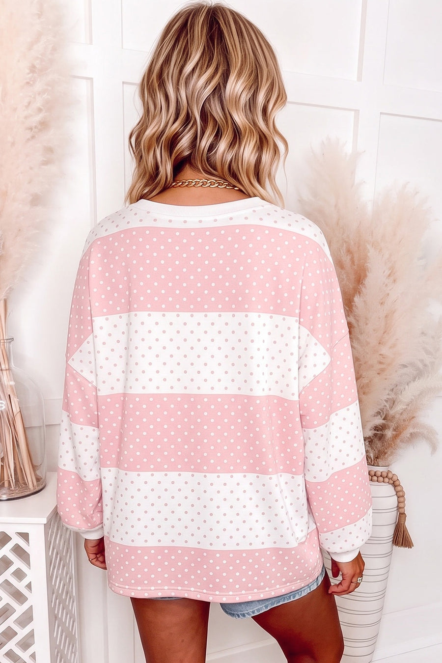 ivory pullover sweater featuring stretch and color-block polka dot