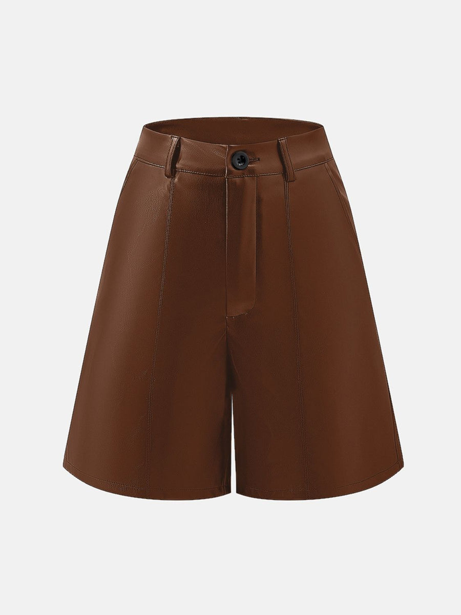 Brown vegan leather bermuda shorts with button closure and tailored seams.