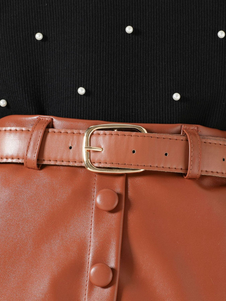Black pearl-embellished top with brown faux leather skirt and belt