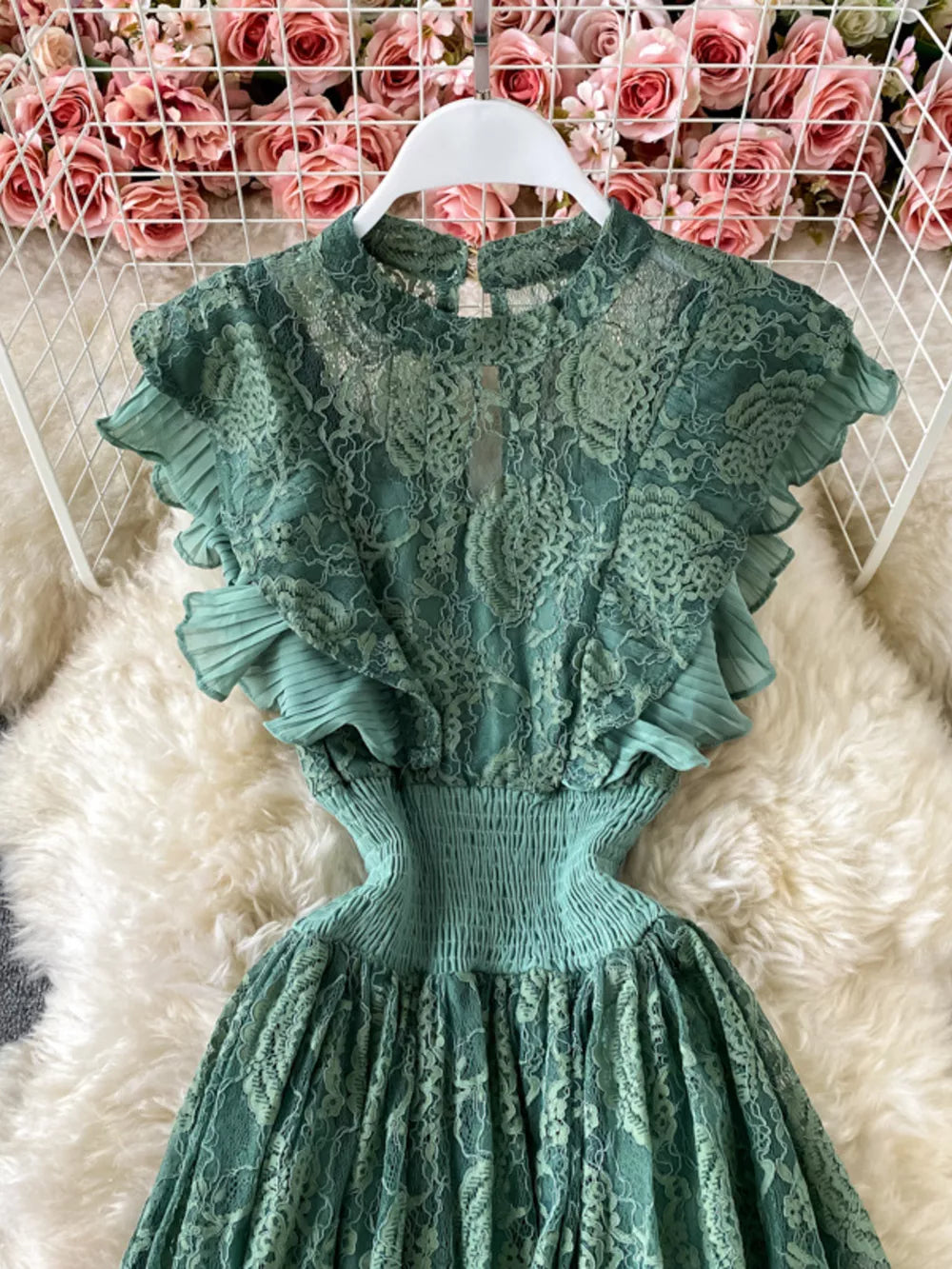 Green lace maxi dress with ruffled sleeves and smocked waist