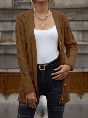 Chestnut cable knit cardigan with button front and long sleeves, worn over a white tank top.