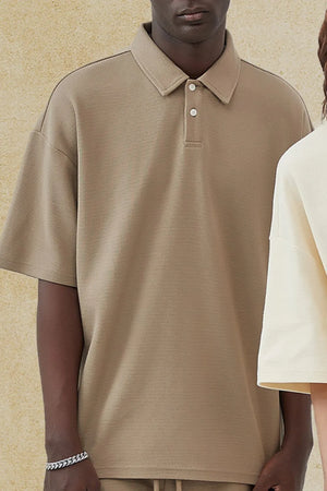 Boxy textured polo shirt in Khaki with short sleeves and a two-button placket.