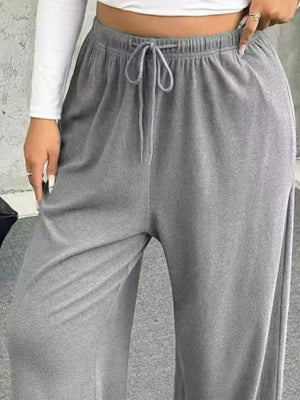 Light gray drawstring wide-leg maternity pants with elastic waistband and casual fit.