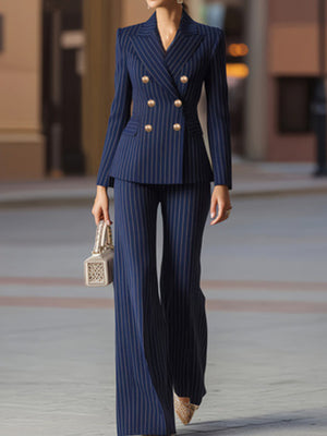 Navy pinstripe blazer with gold buttons and matching wide-leg pants.