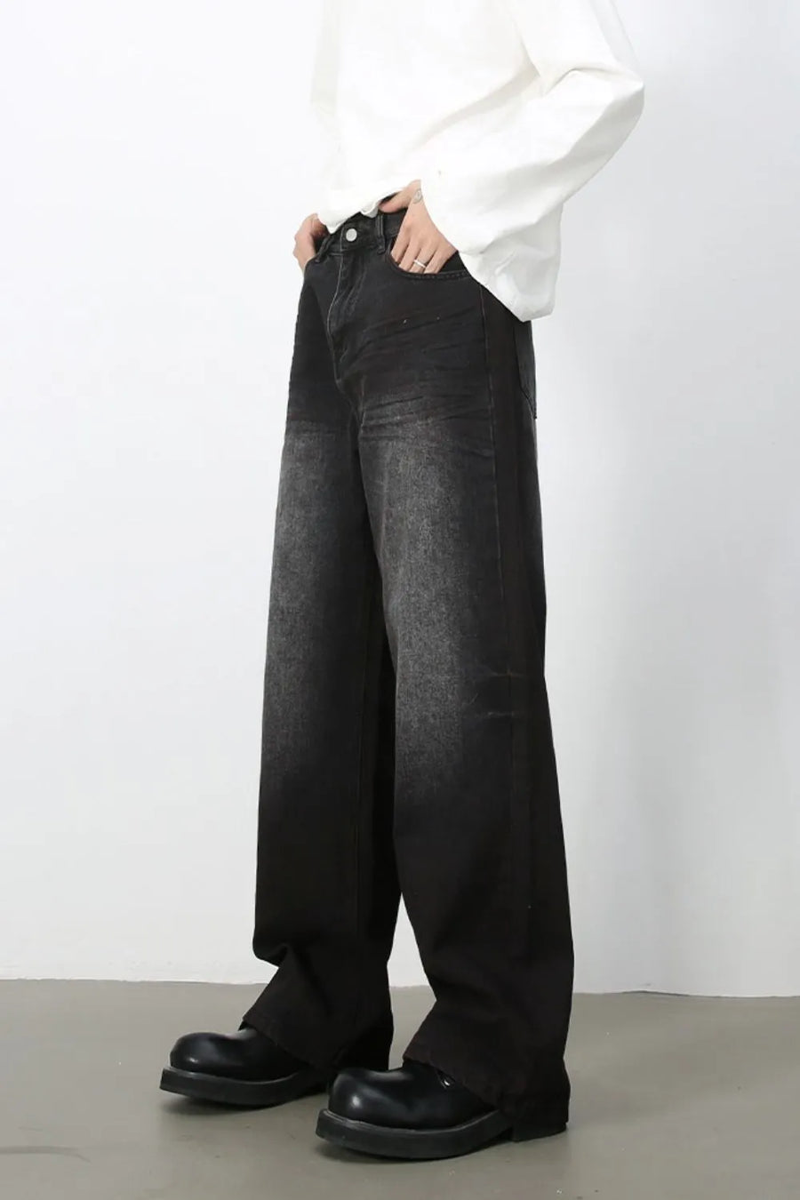 Faded dark wide-leg denim jeans with a relaxed fit.
