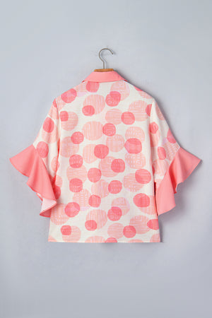 Polka dot babydoll blouse with ruffle trim sleeves and collar.