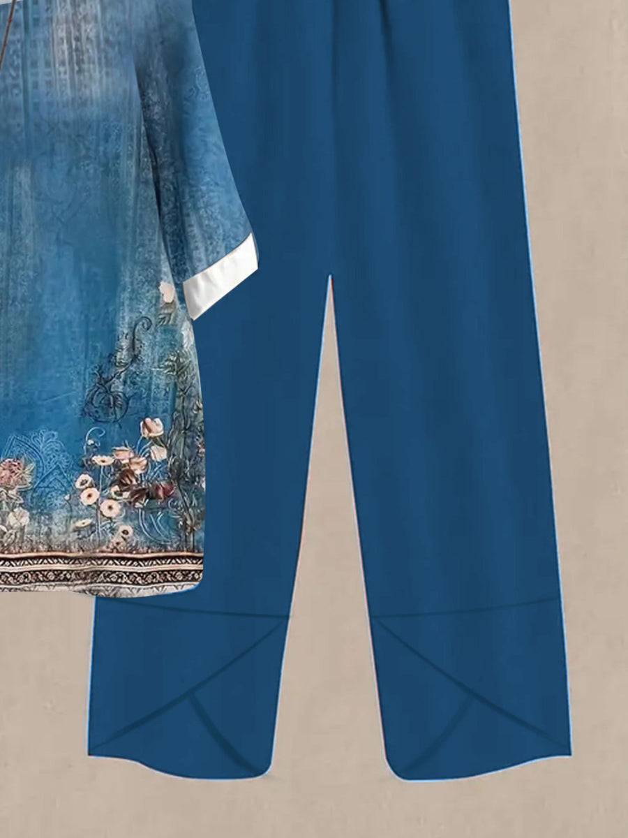 Floral print half sleeve top and solid blue pants set.
