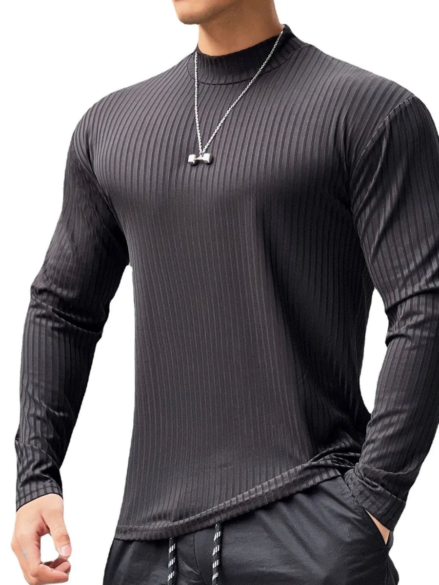 Black ribbed mock neck muscle fit long sleeve shirt with vertical texture.
