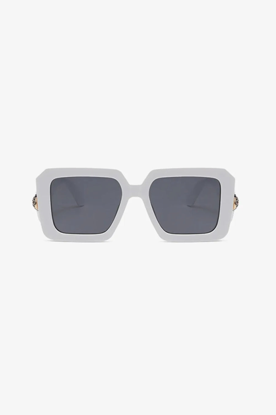 White geometric facet sunglasses with embellished temples and dark lenses.
