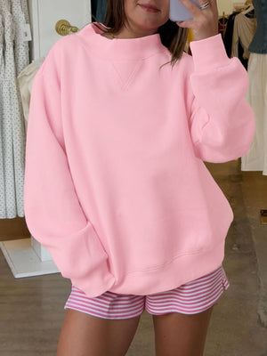 sweatshirt in baby pink featuring dropped shoulder and oversized fit
