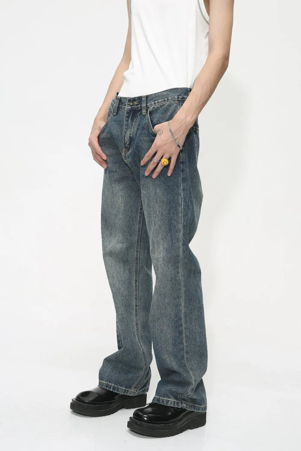 Baggy denim jeans in medium wash with subtle fading and a relaxed fit.