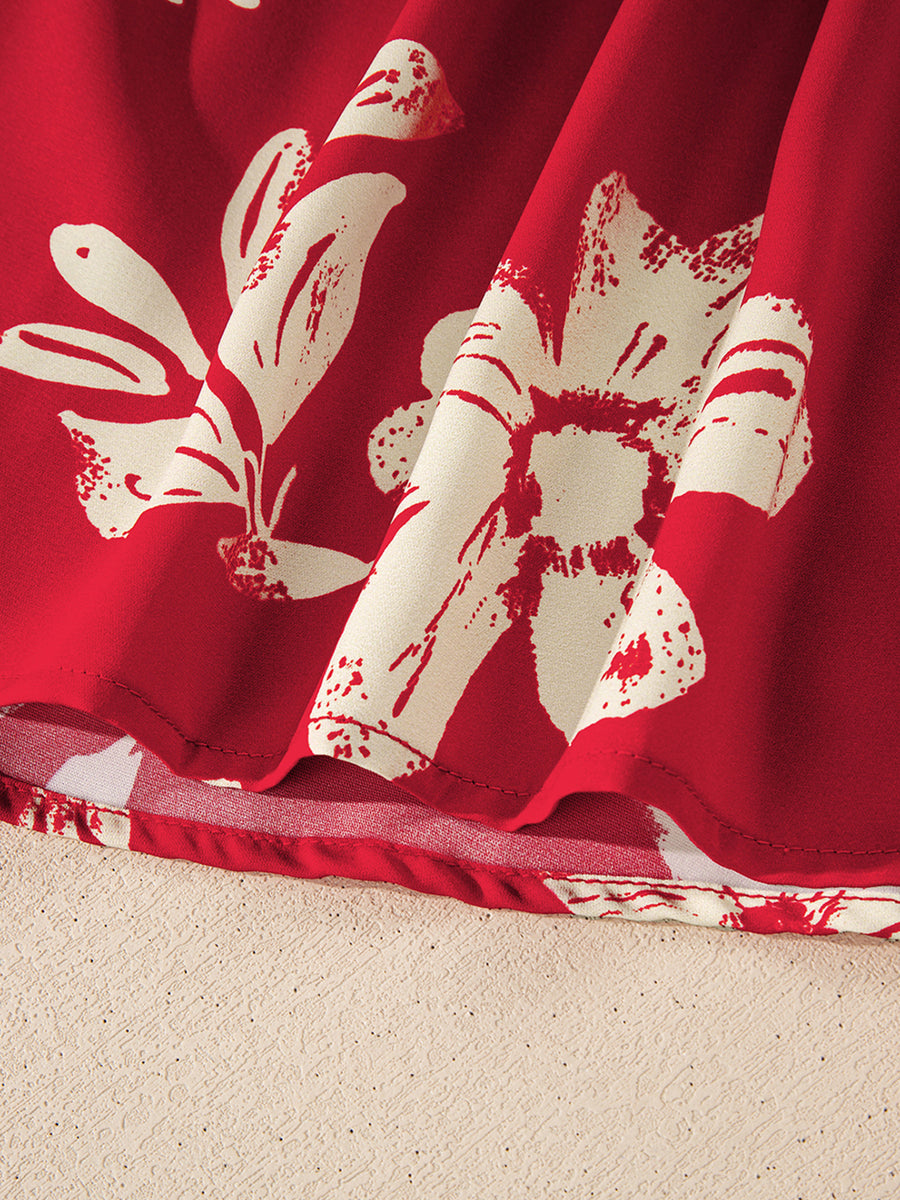 Red floral print blouse with bow tie detail, showing fabric texture and hem.