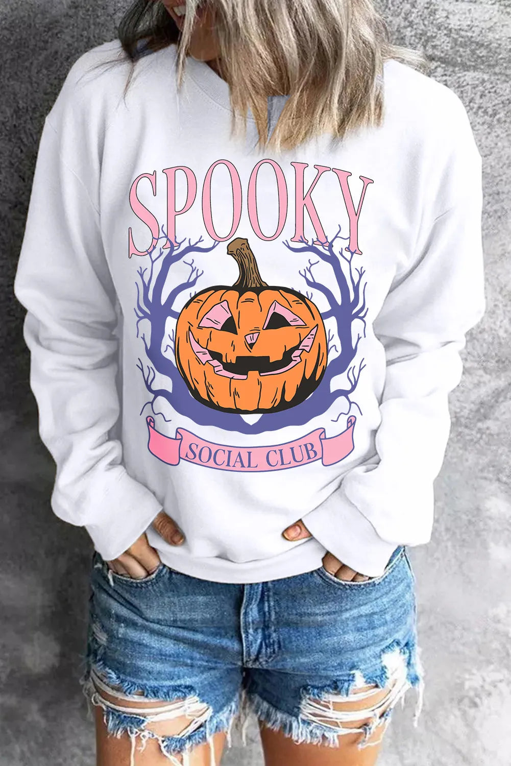 White graphic sweatshirt with jack-o-lantern and Spooky Social Club text