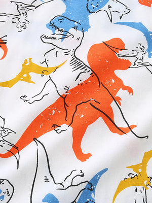 White t-shirt with a colorful dinosaur print featuring orange, blue, and yellow dinosaurs.