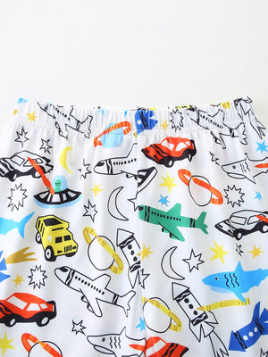 Toddler underwear with a white background and a colorful vehicle print featuring cars, planes, rockets, and sharks.