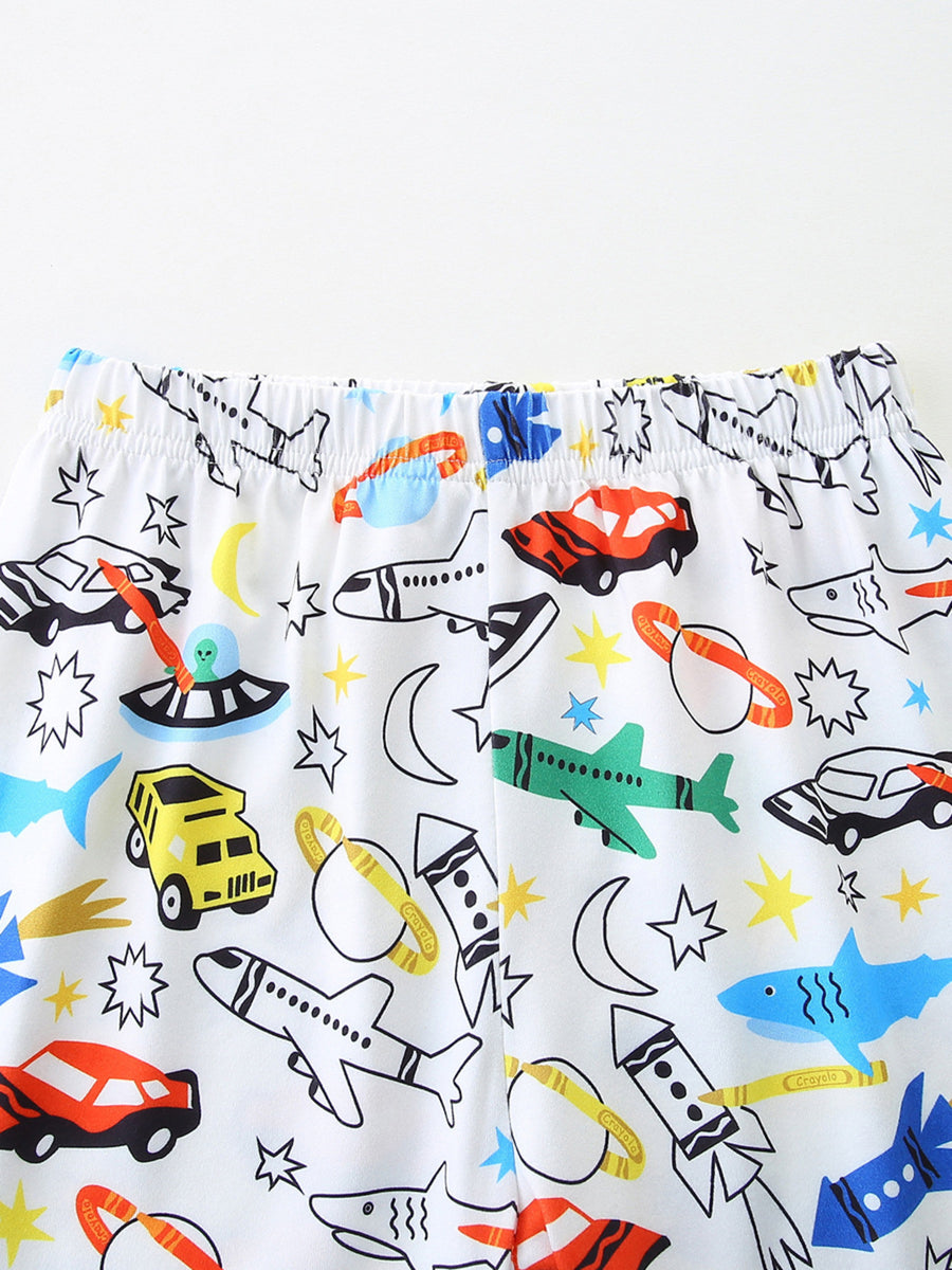 Toddler underwear with a white background and a colorful vehicle print featuring cars, planes, rockets, and sharks.