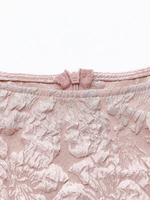 Dusty pink textured floral peplum tank top with a boat neckline and zip closure.