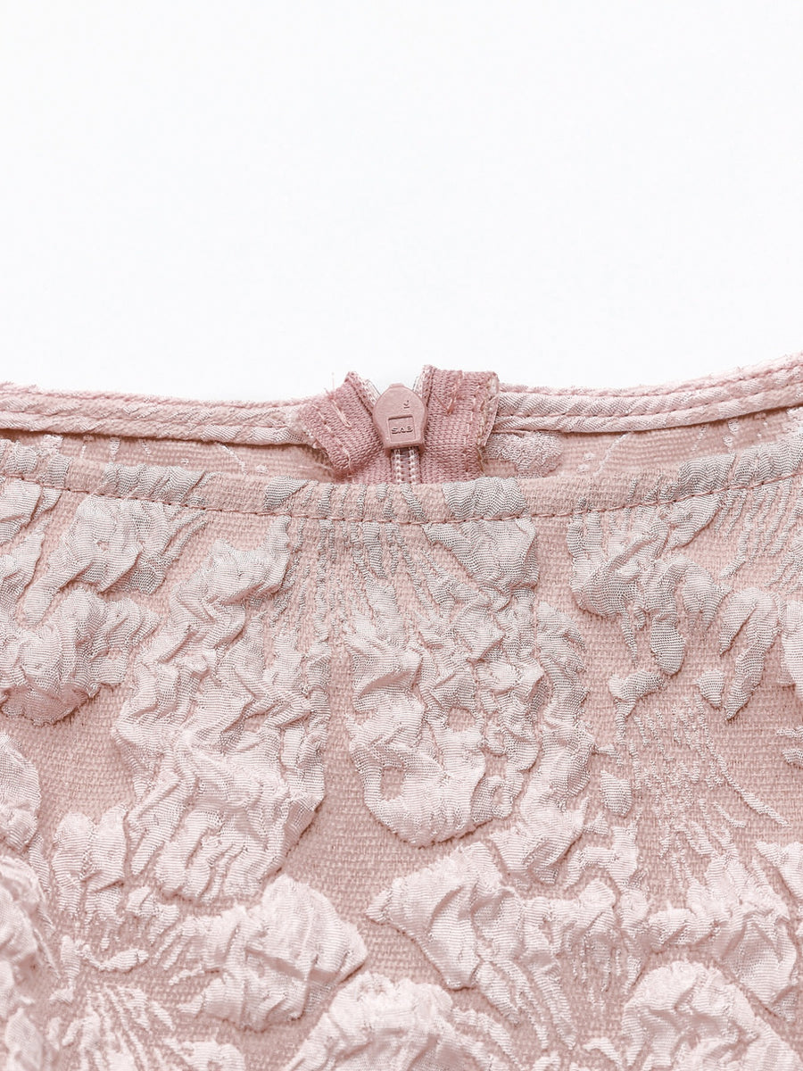 Dusty pink textured floral peplum tank top with a boat neckline and zip closure.