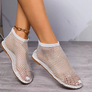 flats in black with geometric and round toe