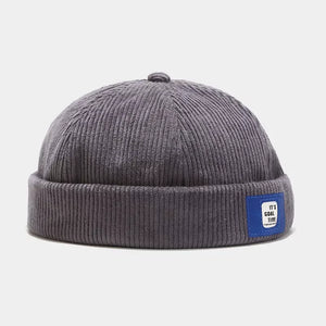 Beige hat with ribbed texture and na