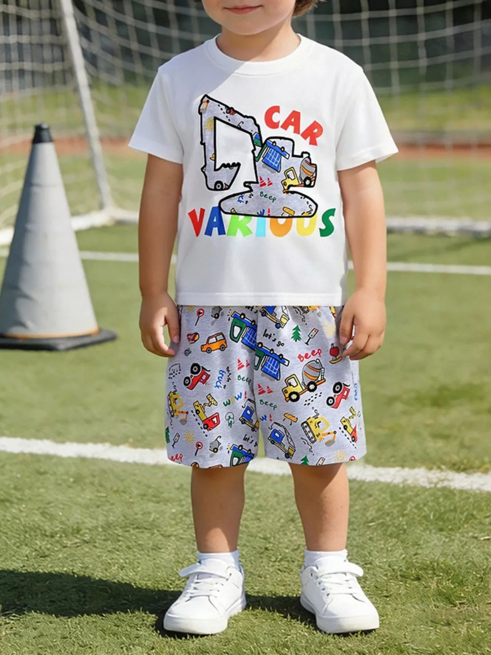 Toddler tee and shorts set with excavator and construction vehicle print.