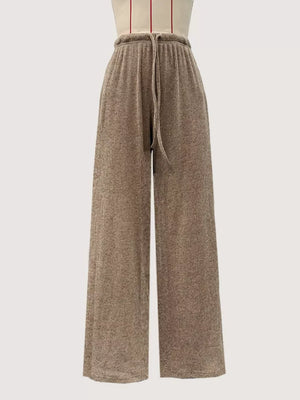Khaki wide-leg drawstring pants with a ribbed texture and elastic waistband.