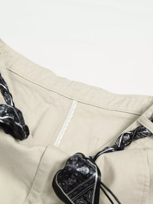 Cream white maternity pants with black paisley print belt detail
