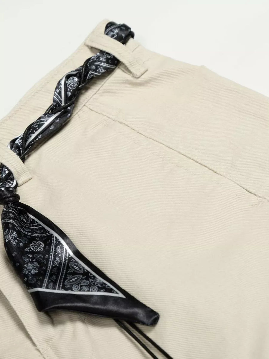 Belted wide-leg maternity pants in cream white with a black paisley print scarf belt detail.