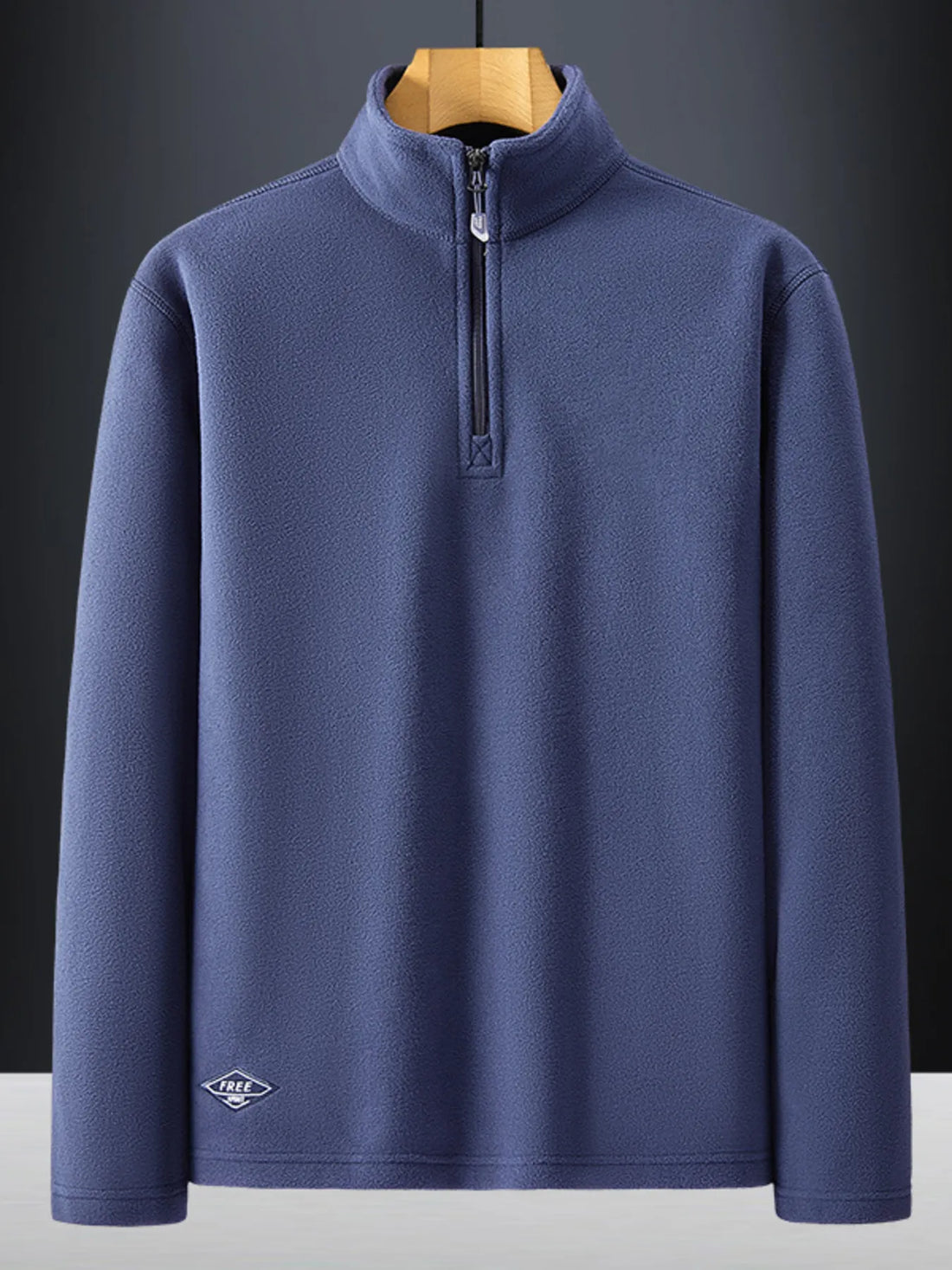 Plus-size dark blue quarter zip sweatshirt with a stand-up collar and subtle embroidered logo detail.