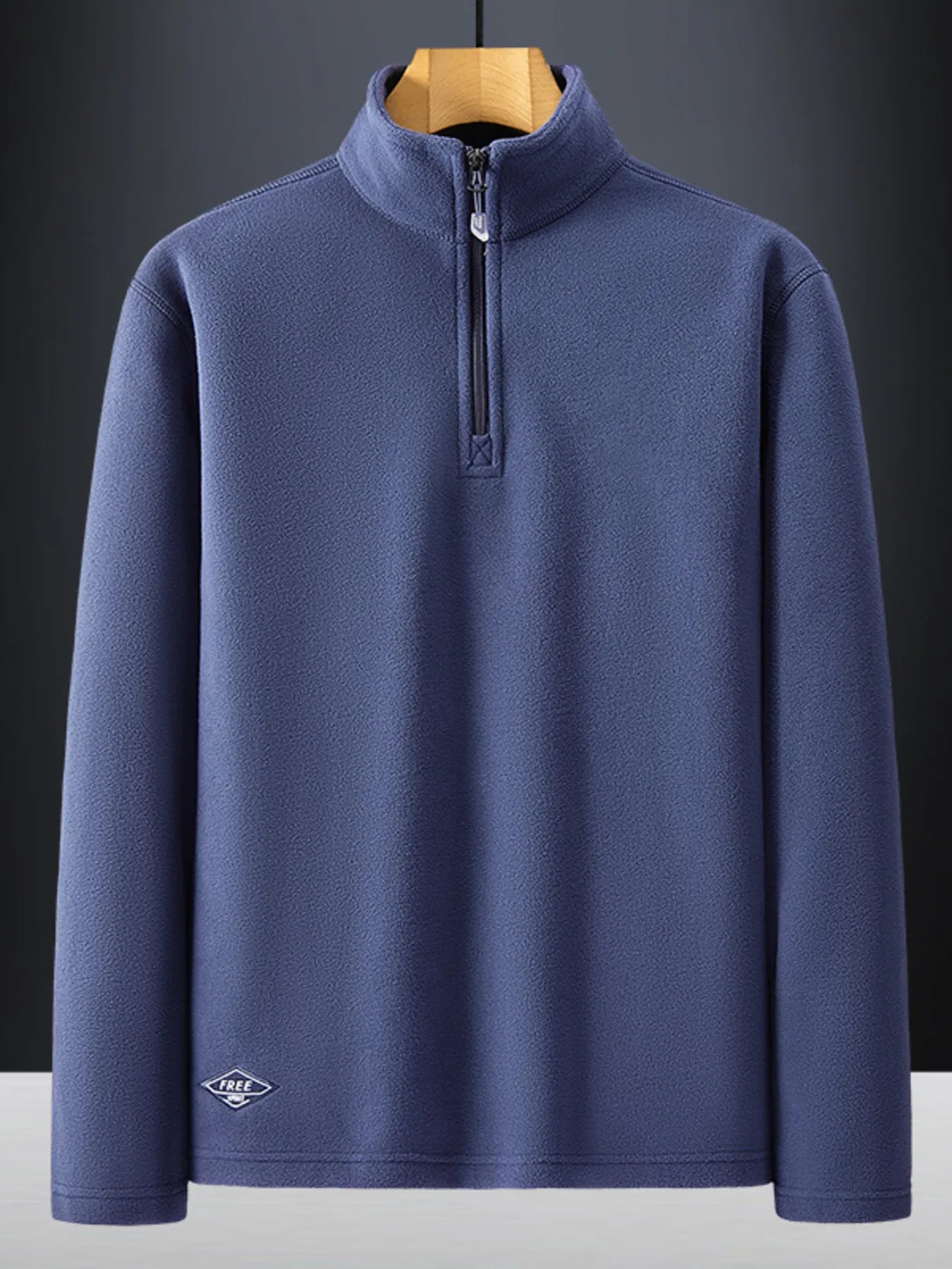 Plus-size dark blue quarter zip sweatshirt with a stand-up collar and subtle embroidered logo detail.