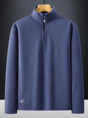 Plus-size dark blue quarter zip sweatshirt with a stand-up collar and subtle embroidered logo detail.