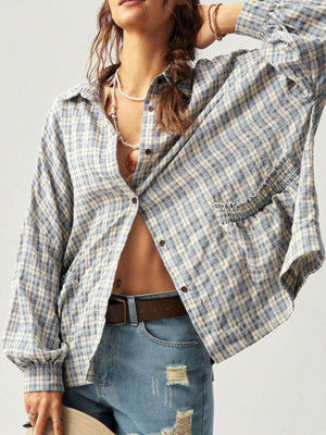 100% polyester Care instructions: Machine wash cold button-down shirt in Light Blue with oversized silhouette